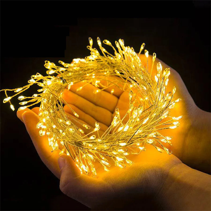 Warm white cluster fairy lights held in cupped hands