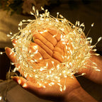 Warm white cluster fairy lights held in open hands