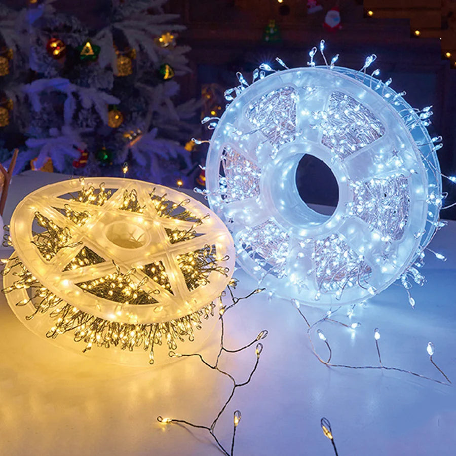 Warm white and white firecracker cluster light reels side by side