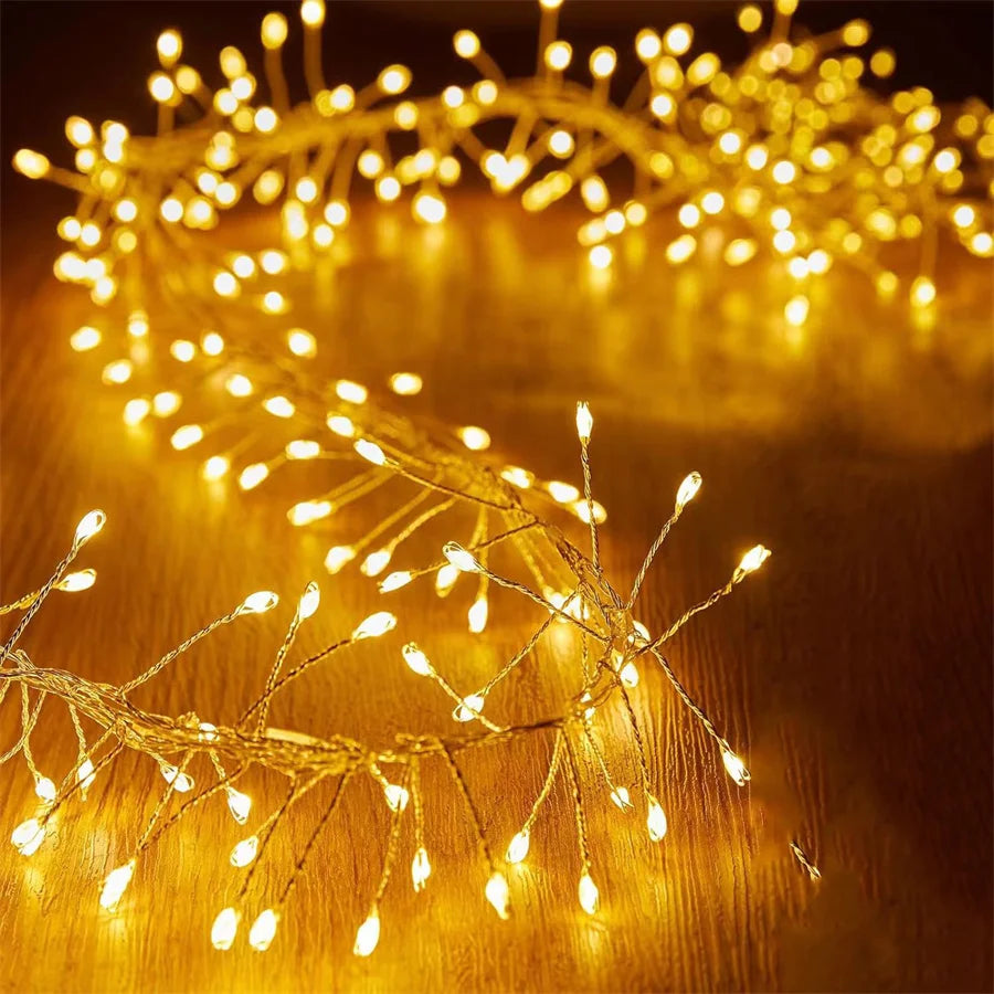 Close-up of warm white firecracker LED clusters on copper wire