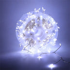White firecracker cluster lights on a reel with a cool white glow