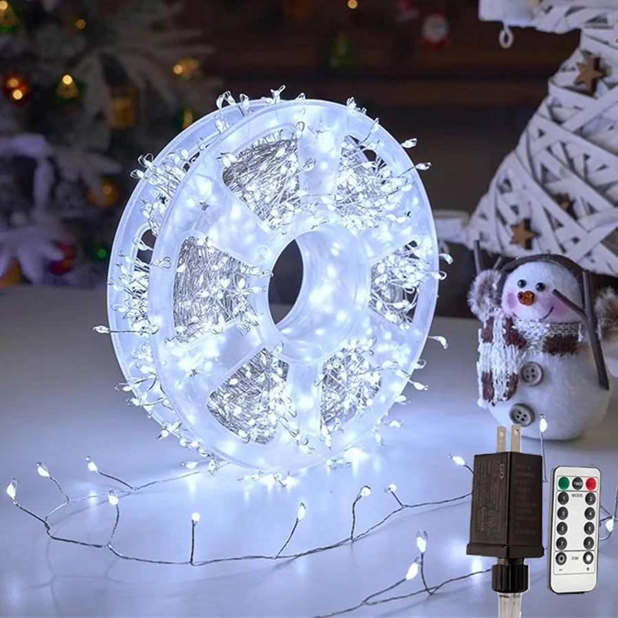 Nova firecracker cluster Christmas lights in white on a reel with UK plug adapter and remote