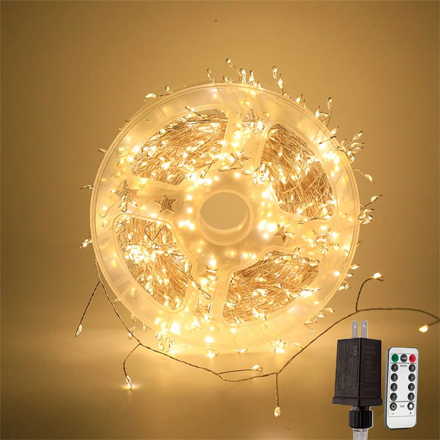 Warm white cluster lights coiled on a reel and lit up