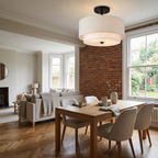Black-canopy lamp in a modern British living and dining area