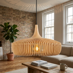 Close-up of natural wood slatted pendant light glowing warm