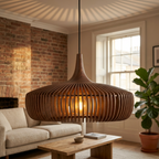 Close-up of walnut slatted pendant light glowing warm