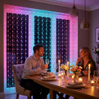 Christmas dinner party with RGB curtain lights as a backdrop