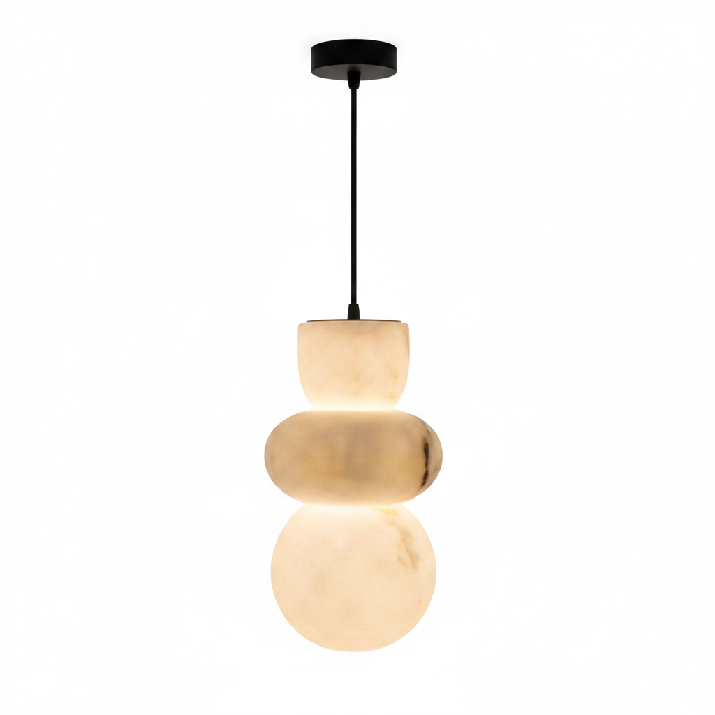 Stacked marble pendant light lit warm, hanging from a black cable and ceiling canopy
