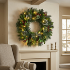 Green pre-lit Christmas wreath above a fireplace in a cosy UK living room
