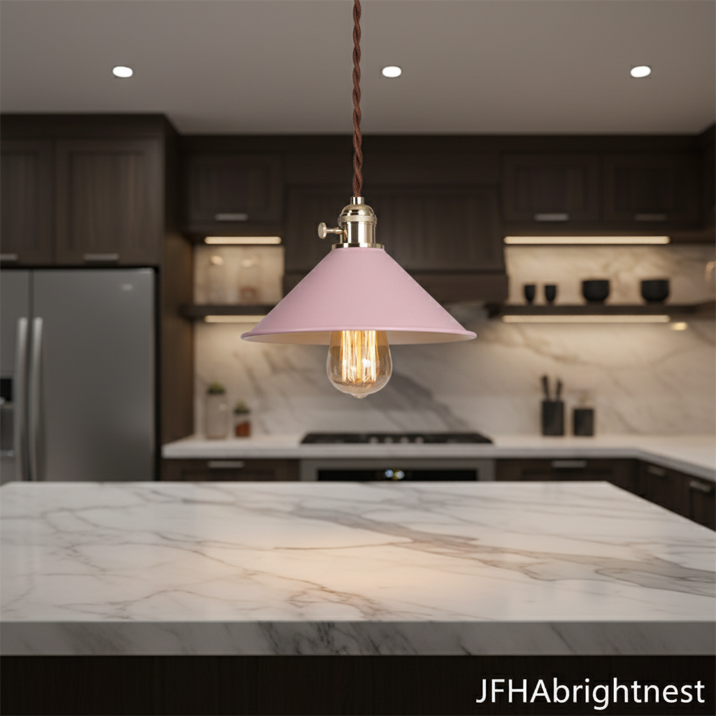 Pink cone pendant light hanging above a kitchen worktop