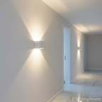 White Norvik indoor wall light in a hallway, cool white