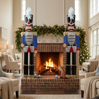 Blue 6ft nutcracker decorations beside a lit fireplace with garland