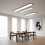 Rilo Oval Ceiling Light in black finish above dining table with three colour light modes