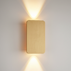 Close-up of the Ingram wall light in gold brushed metal