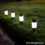 Rowan solar LED garden stake lights along stone pathway at dusk with JFHAbrightnest branding