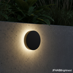 Klyne outdoor wall light in Black Round at night