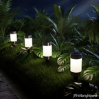 Rowan solar LED garden stake lights in tropical garden at midnight with JFHAbrightnest branding