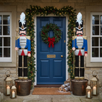 Blue 6ft nutcracker decorations either side of a blue front door with wreath
