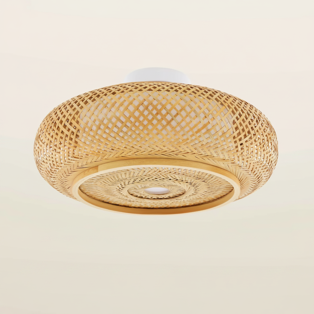 Bamboo flush mount ceiling light fitted to a ceiling, warm light glowing through the weave