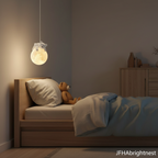 Ivory kids globe pendant light hanging beside child's bed in Scandi room