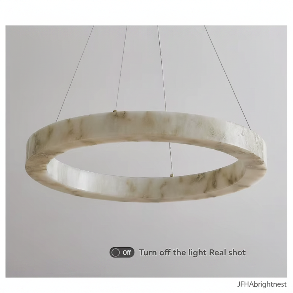 Marble disc pendant light switched off, showing the veined shade detail