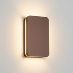 Close-up of the Ingram wall light in coffee brown brushed metal
