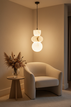 Marble pendant light on a cable in a living room reading corner