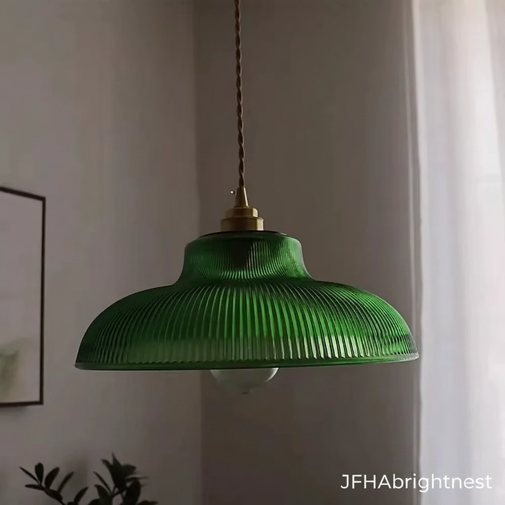 Green ribbed glass pendant light hanging in a living room beside a framed print