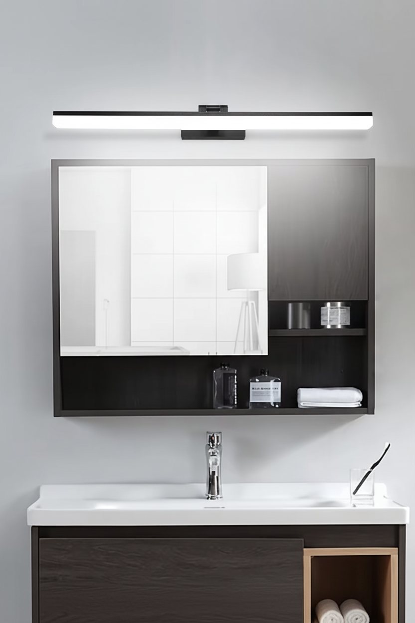 Black LED mirror light above a bathroom mirror and basin