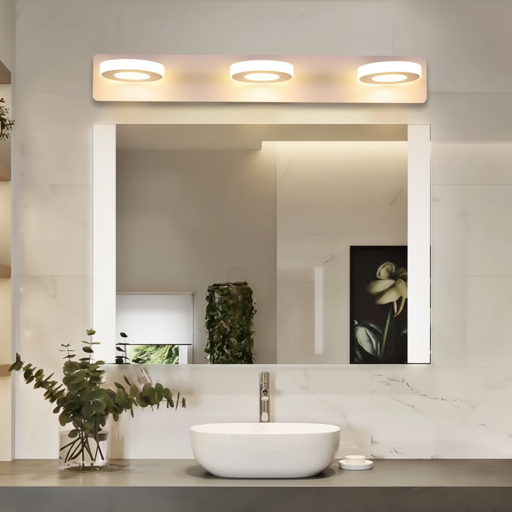 Warm white 3-light bathroom wall light above a marble vanity mirror