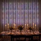 Multicolour LED curtain lights as a celebration dining room backdrop