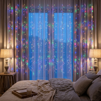 Multicolour LED curtain lights in a cosy bedroom