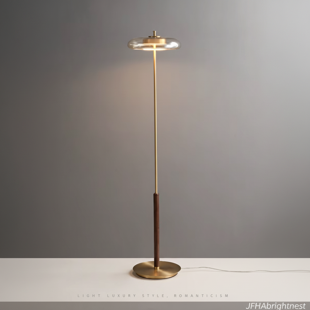 Nesta glass mushroom floor lamp, 128 cm tall, amber glass shade on a brass stem with a walnut collar