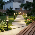 Warm white solar lawn lights lining a modern UK garden pathway