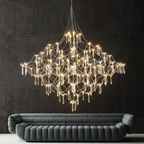 Celeste crystal cascade LED chandelier above a velvet sofa in a modern living room