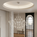 Chrome Celeste crystal chandelier hanging from a domed ceiling in a bright entrance hall