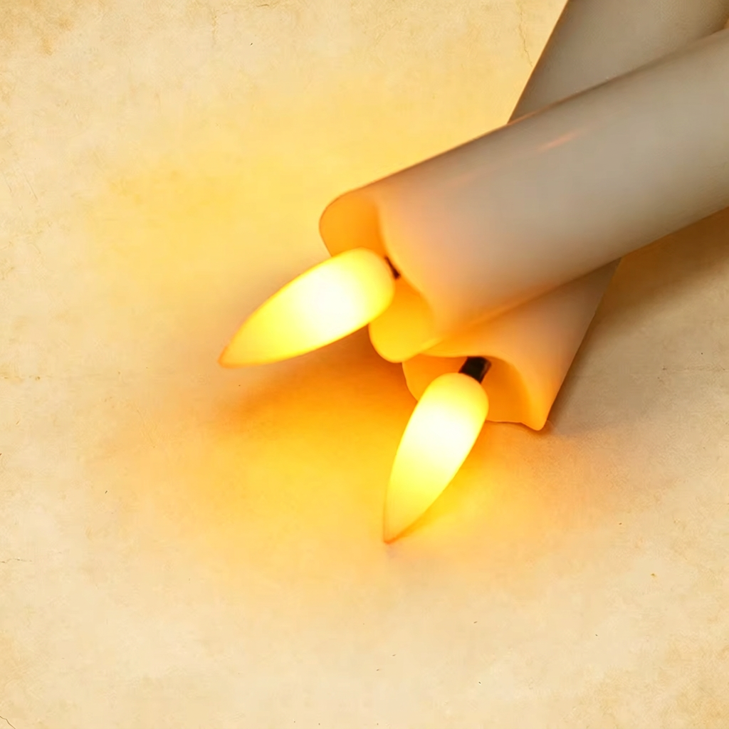 Square close-up of two glowing ivory flameless candles