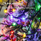 IP44 water-resistant multicolour Christmas lights on a snowy tree