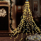 Warm white waterfall Christmas lights decorating a snowy front entrance