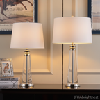 Both sizes of the Vera crystal table lamp side by side on a dark console table