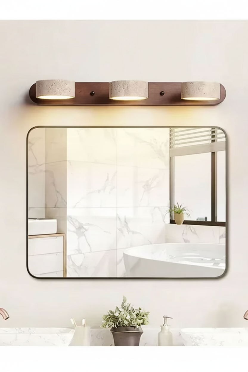 Walnut 3-light wall light above a bathroom mirror