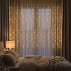 Warm white LED curtain lights on a cosy bedroom wall