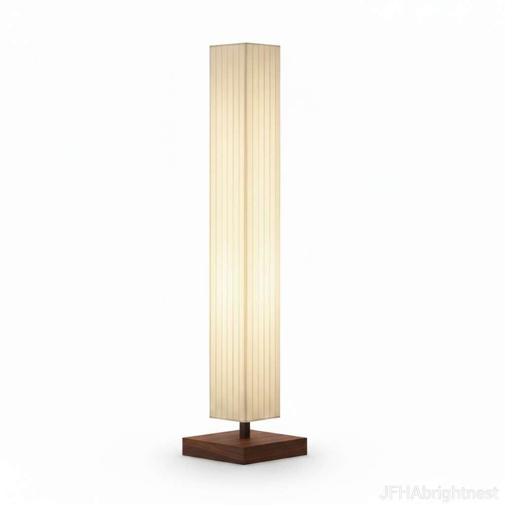 Yuki Wabi Sabi floor lamp lit on a plain white background, pleated fabric column on a square walnut wood base